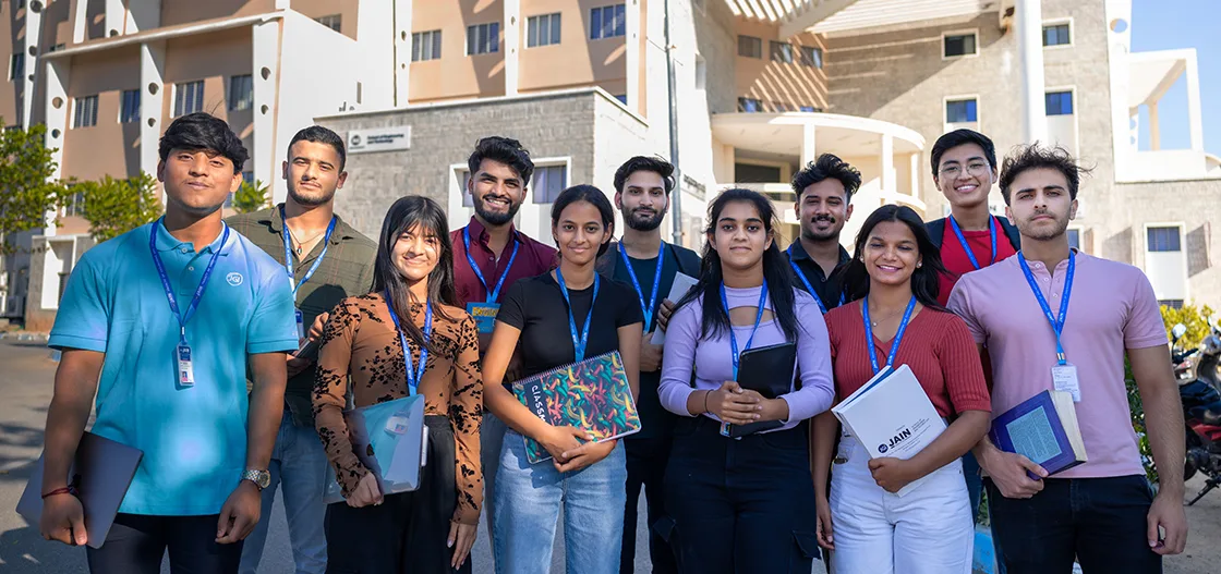 Students from IIAEM, JAIN (Deemed-to-be University), a top aerospace engineering college in India, smiling outdoors.